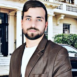 الأستاذ علي الطلالي